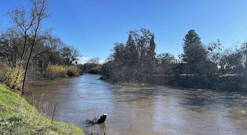 Bear Creek in Merced rose above flood level after storms pummeled the area in January 2023. 