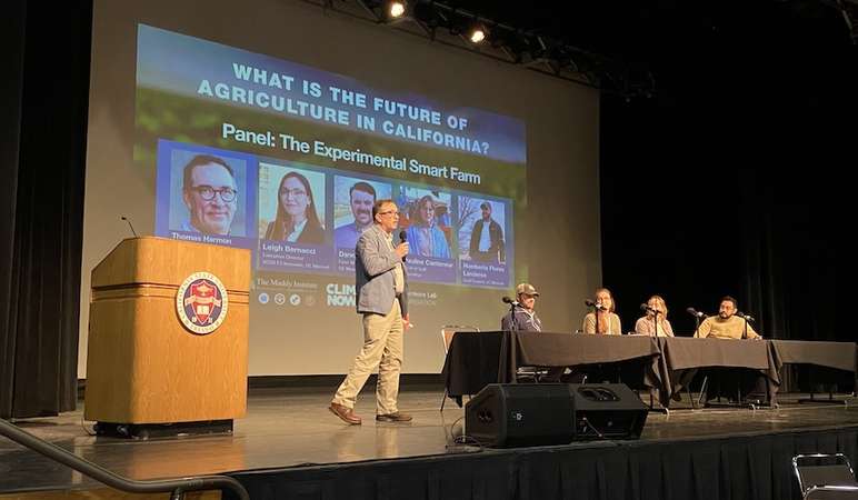 UC Merced Professor Tom Harmon introduces a panel discussion of the university's Experimental Smart Farm at a symposium on the Future of Agriculture. 