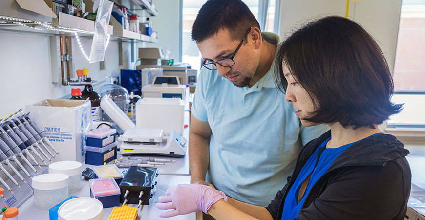 Professor Jing Xu and student Arturo Zaragoza in molecular lab