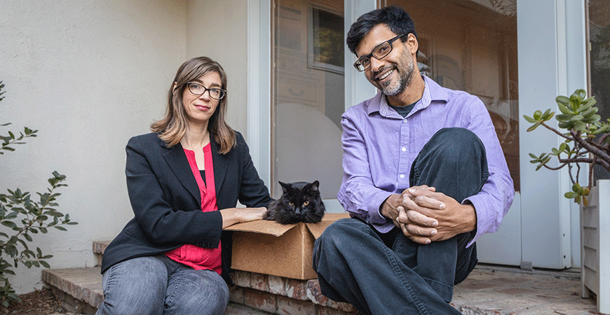 Professors Christine Isborn and Harish Bhat with cat in box
