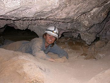 Professor Jessica Blois doesn't mind crawling around in caves for her work.
