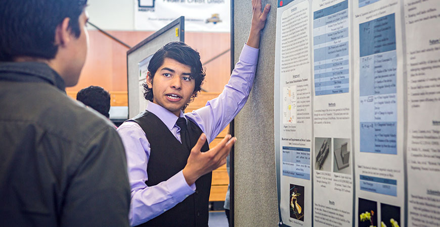 Student presents research poster