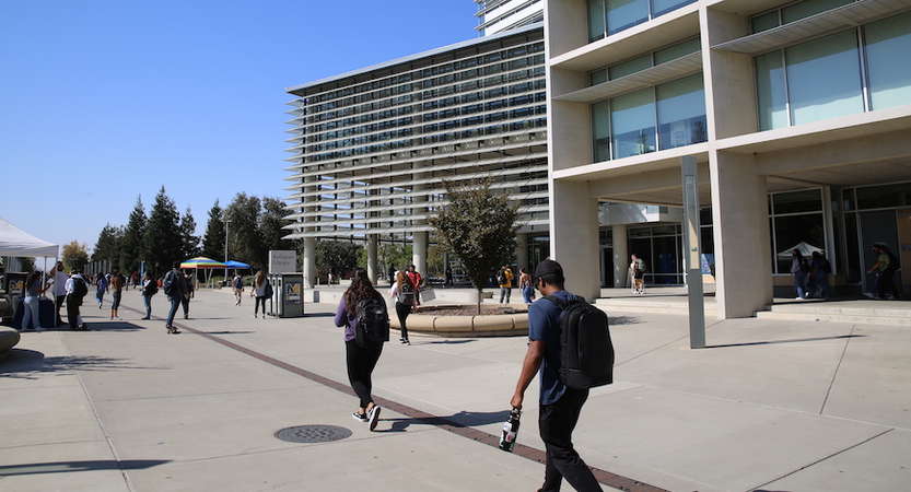 Students walk across campus at UC Merced.