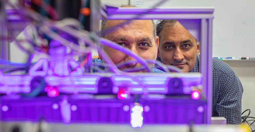 Professor Ehsani and researcher Arash Toudeshki in a lab