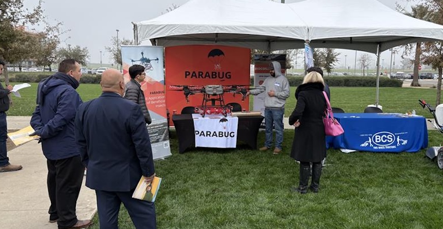 Photo depicts a vendor demonstrating a drone on the UC Merced campus.